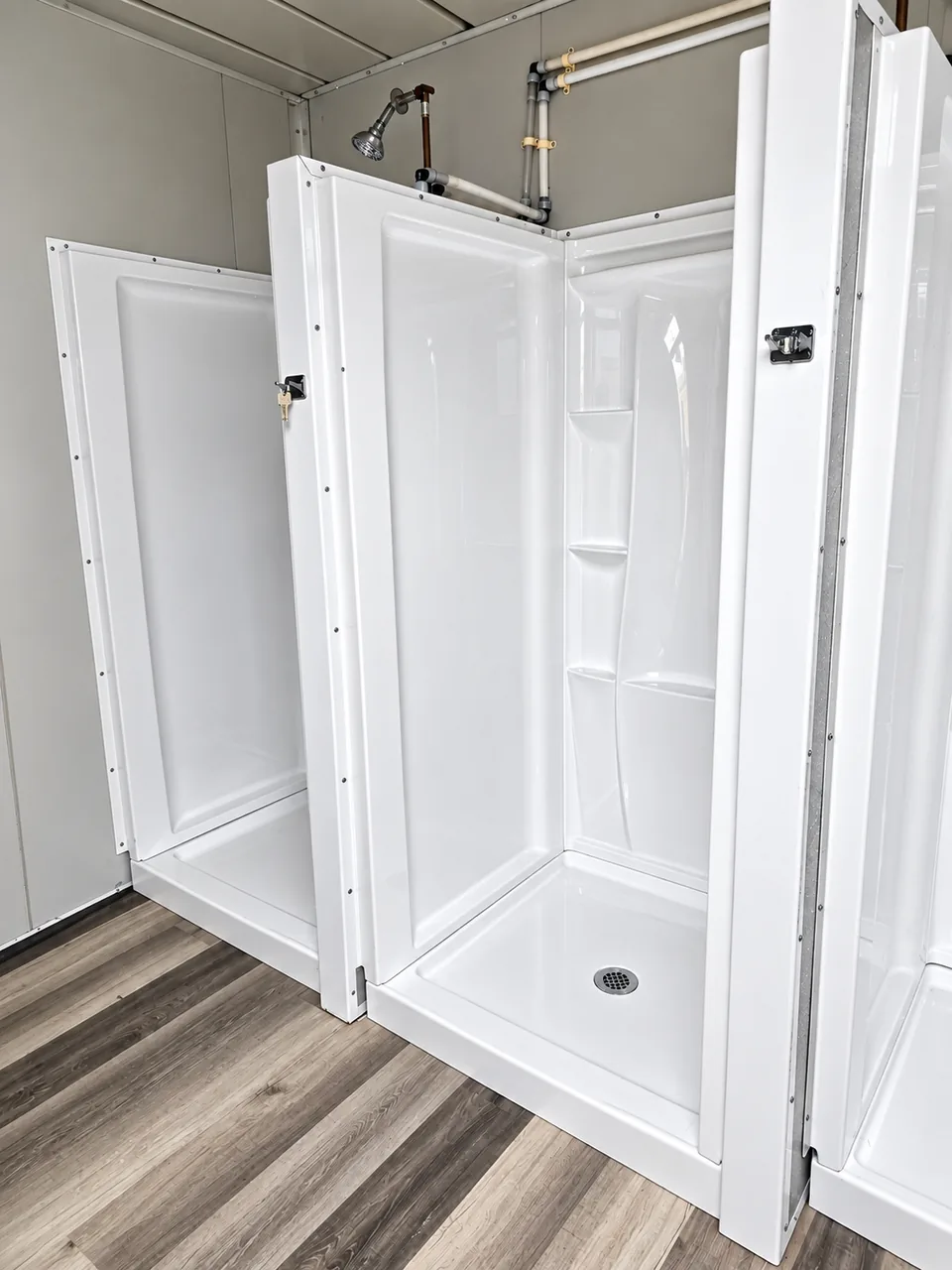 Shower stalls inside a 20-foot shower container